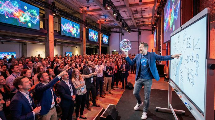 Energetic presenter using creative props with amazed laughing audience and colorful slides