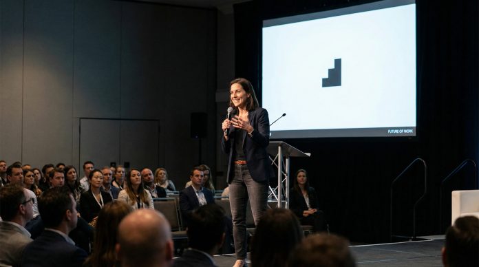 Confident speaker presenting naturally without looking at screen making eye contact with audience