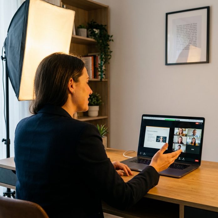 Professional presenting on a video call from a tidy home office with proper lighting